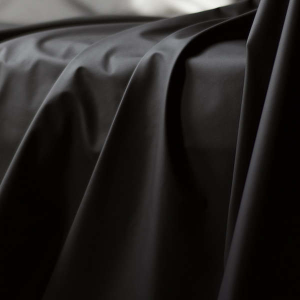 Black Sheets of San Francisco Fluidproof and Lube proof throw showing drapes and folds