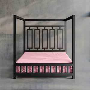 Product image of a Pink Sheets of San Francisco Waterproof, lube proof and fluid proof bed sheet designed to protect the mattress from and mess and fluids during sex. Displayed on a black metal four poster dungeon bed set against a grey polished concrete floor